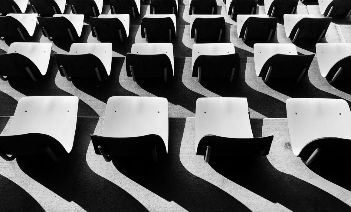 grayscale photography of chairs with no people