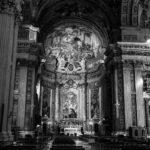 grayscale photo of people inside cathedral