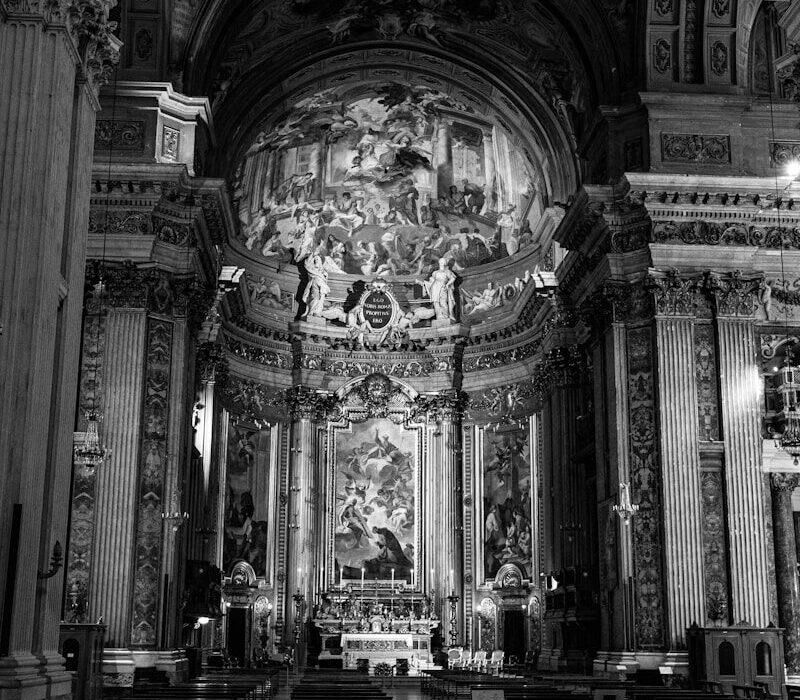 grayscale photo of people inside cathedral